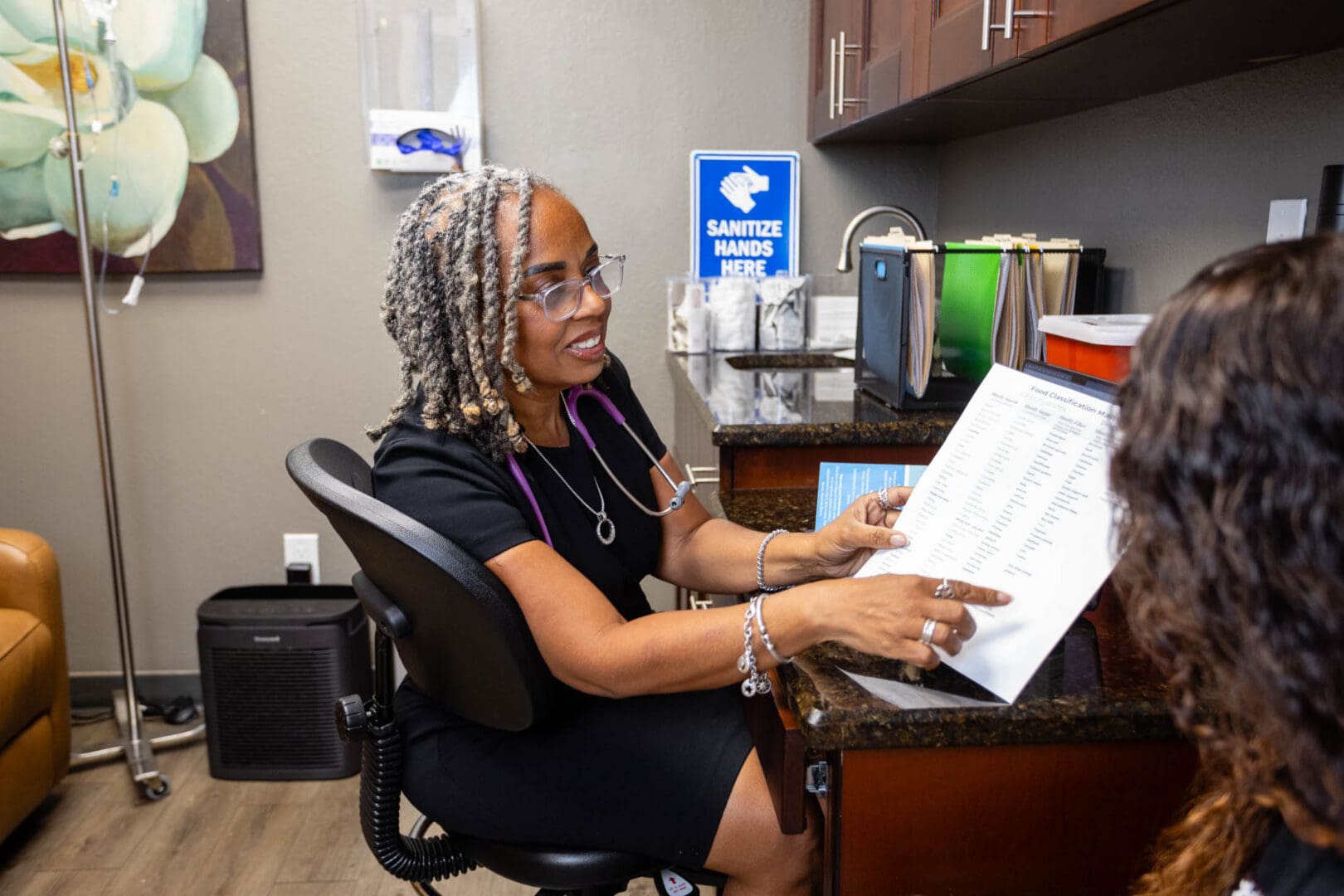 Doctor explaining document to a patient.