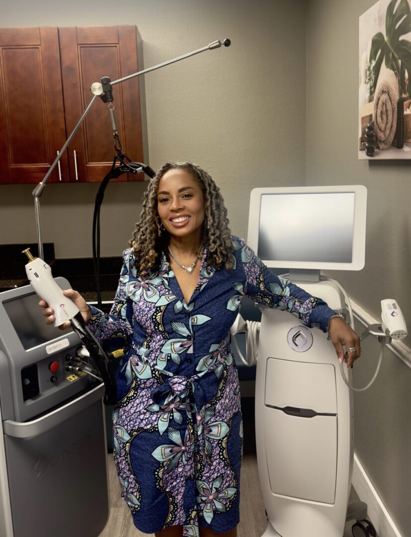 Woman holding skincare device in treatment room.