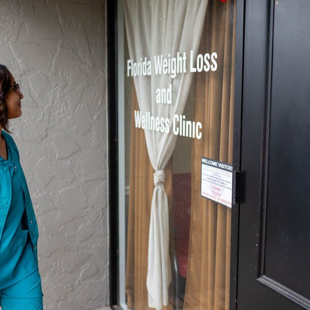 Person entering weight loss and wellness clinic.